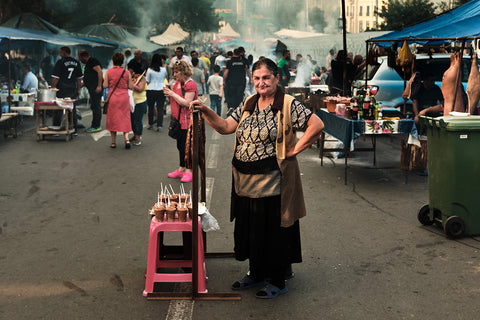 A woman selling ice cream at Tbilisoba celebrations in Tbilisi, Georgia