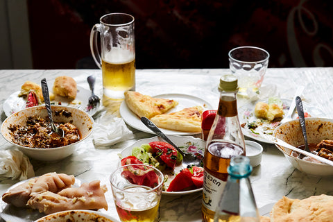 A table of traditional Georgian food and beer at the Coca Cola cafe in Tbilisi, Georgia