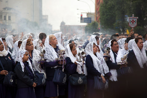 A crowd of women in lace shawls in the streets of Lima, Peru