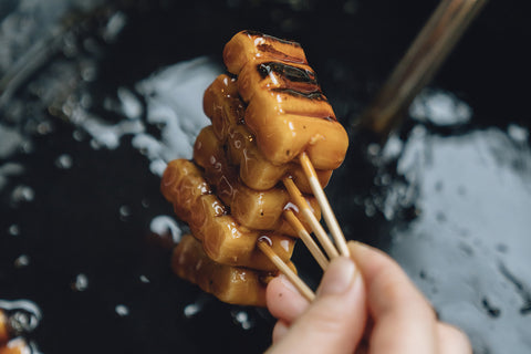 Mitarashi dango sweets on skewers at Umezono in Kyoto, Japan