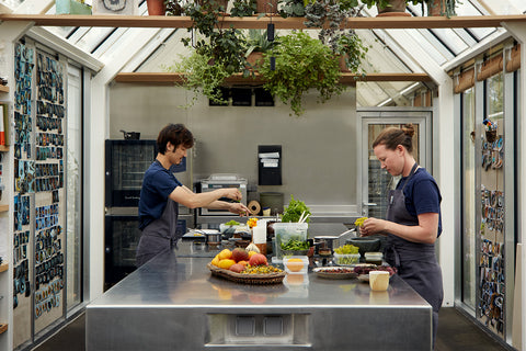 Two chefs work on developing recipes in noma test kitchen in Copenhagen, Denmark