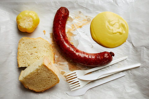 Kolbász sausage, mustard, and bread from Pinczi Hús-Hentesáru Bolt butcher shop in Budapest, Hungary