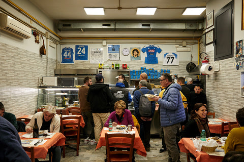 Customers enjoy their lunch at Cibi Cotti Nonna Anna restaurant in Naples, Italy