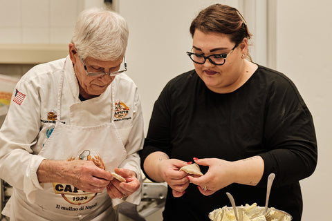 Chef Sabatino Sirica and his granddaughter make sfogliatelle pastries in San Giorgio a Cremano, Naples, Italy