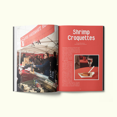 An interior spread of Fare magazine's Antwerp, Belgium city guide, featuring photographs of shrimp croquettes