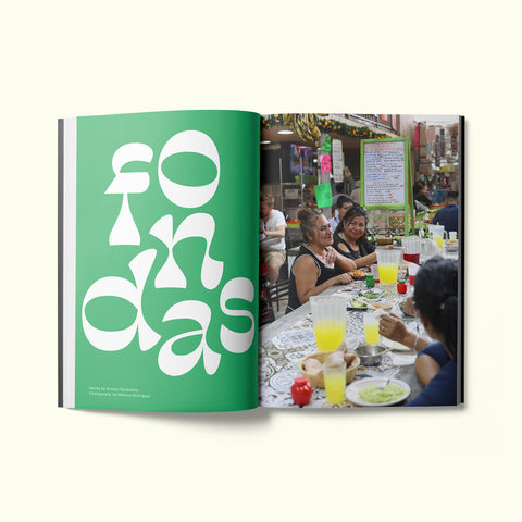 An interior spread of Fare magazine's Mexico City (CDMX) city guide, featuring a photograph of two women eating lunch together at a fonda
