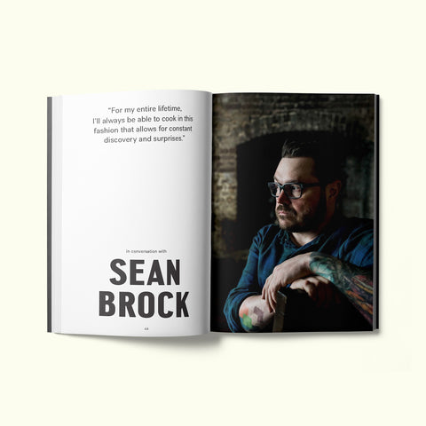 An interior spread of Fare magazine's Charleston, South Carolina city guide, featuring a portrait and interview of chef Sean Brock