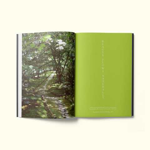 An interior spread of Fare magazine's Kyoto, Japan city guide, featuring a photograph of a forest walkway