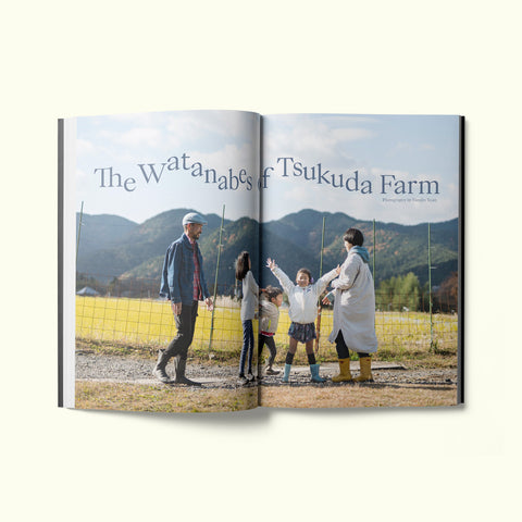An interior spread of Fare magazine's Kyoto, Japan city guide, featuring a photograph of the Watanabes family at Tsukuda Farm in Ohara