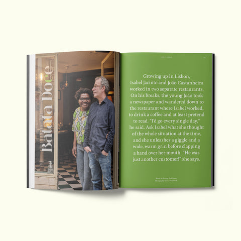 An interior spread of Fare magazine's Lisbon, Portugal city guide, featuring a photograph of Isabel Jacinto and João Castanhiera in front of their restaurant, Batata Doce