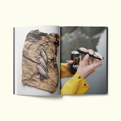 An interior spread of Fare magazine's Helsinki city guide, featuring photographs of herring from the fish market in Helsinki, Finland