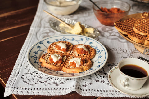 A plate of waffles with cloudberry jam at Vikgården restaurant in Mosjøen, North Norway
