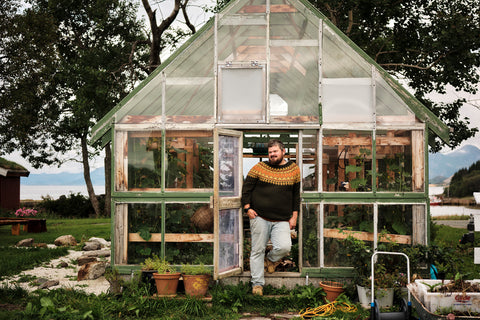 Chef Halvar Ellingsen outside the greenhouse at his restaurant Kvitnes Gård in North Norway