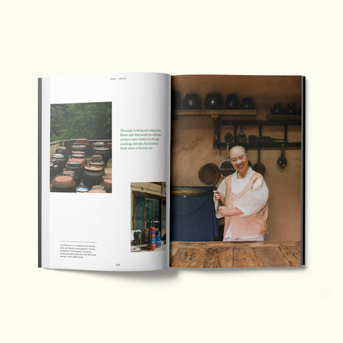 An interior spread of Fare magazine's Seoul, South Korea city guide, featuring a photograph of chef and monk Jeong Kwan in the kitchen of Baekyangsa temple