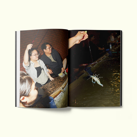 An interior spread of Fare magazine's city guide to Taipei, featuring photographs by Sam A. Harris of locals catching shrimp on Jinzhou Street in the Zhongshan District
